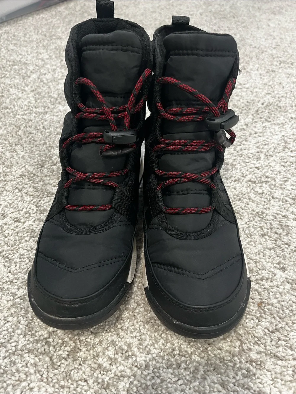 Sorel Kids Black Snow Boots with Red Lace Accents